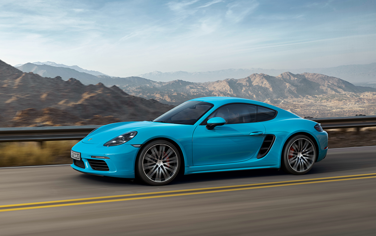 Porsche_Cayman_Light_Blue_Side_Motion_528446_1280x802.jpg